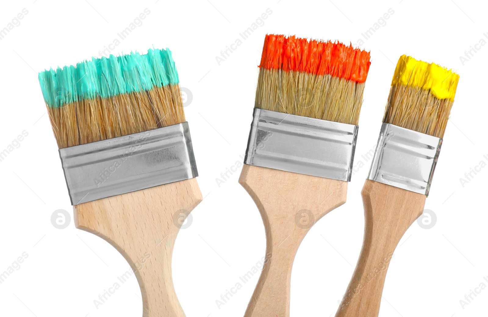 Brushes with different paints isolated on white Photo of Brushes with different paints isolated on white