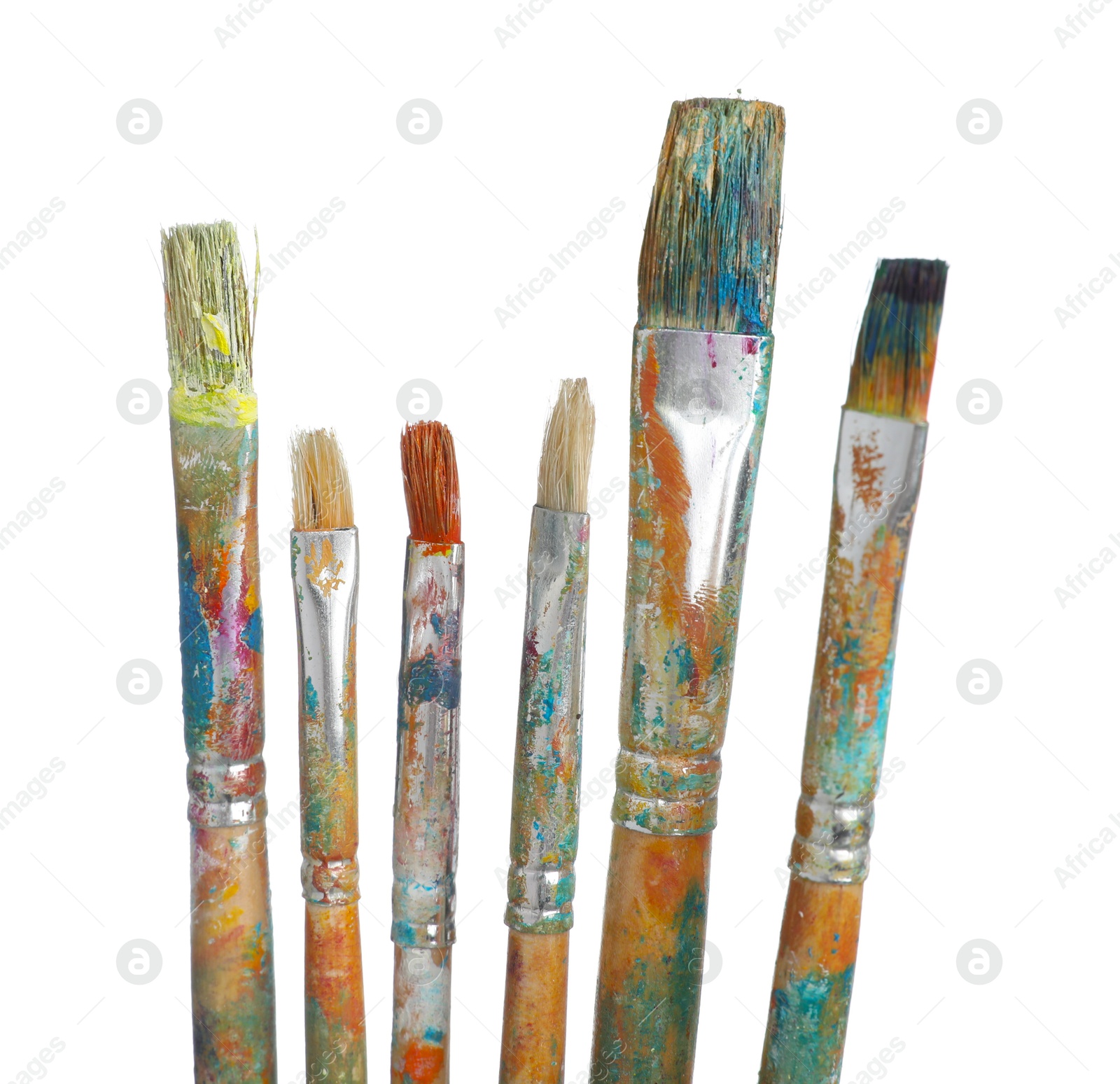Brushes with different paints isolated on white Photo of Brushes with different paints isolated on white