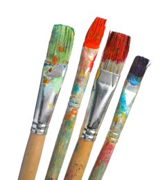 Photo of Brushes with different paints isolated on white