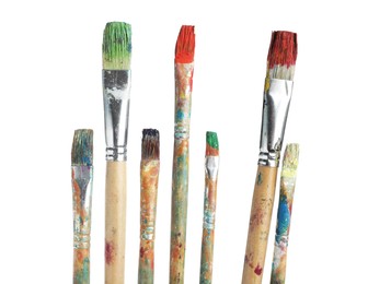 Photo of Brushes with different paints isolated on white