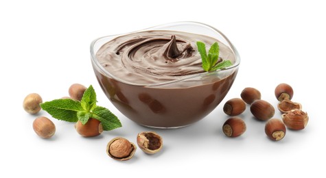 Photo of Tasty chocolate spread with mint and hazelnuts isolated on white