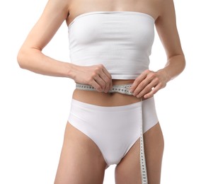 Photo of Woman with slim body and measuring tape on white background, closeup