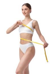 Photo of Woman with slim body and measuring tape on white background