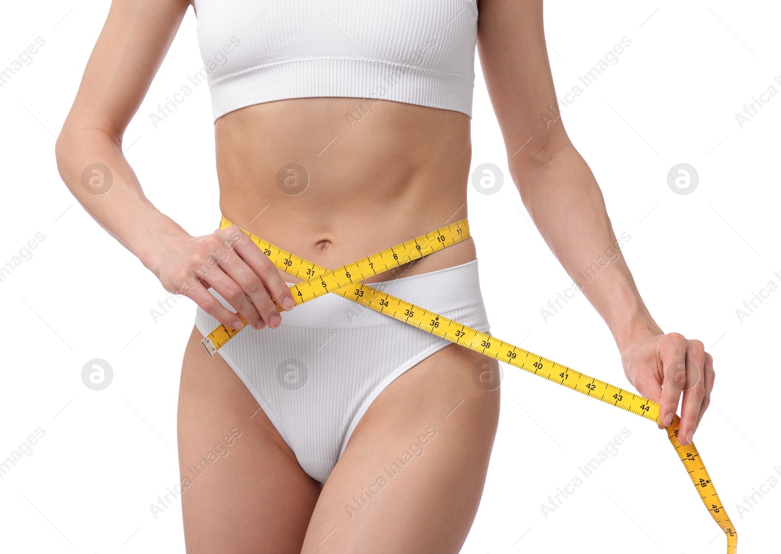 Woman with slim body and measuring tape on white background, closeup Photo of Woman with slim body and measuring tape on white background, closeup