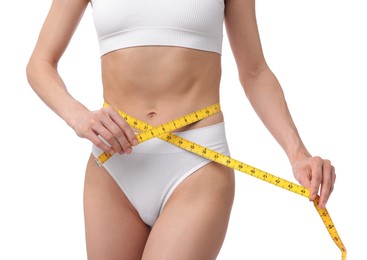 Photo of Woman with slim body and measuring tape on white background, closeup