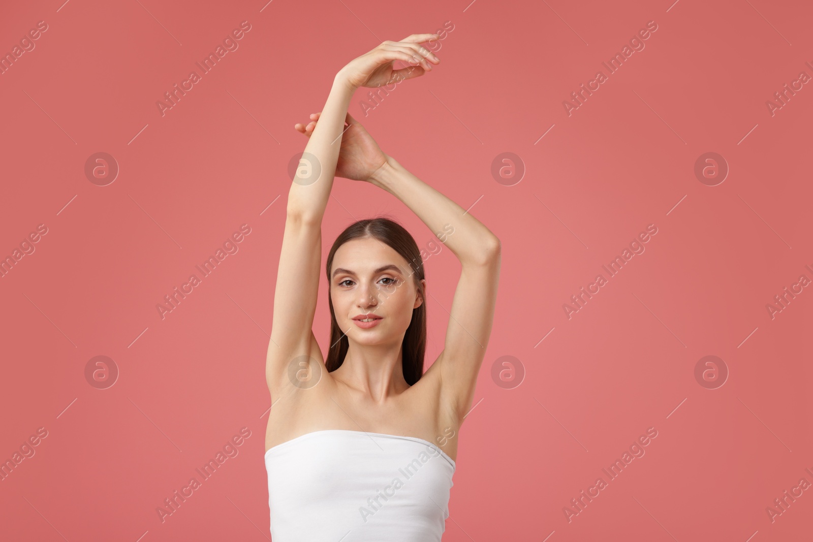 Portrait of beautiful young woman on pink background Photo of Portrait of beautiful young woman on pink background