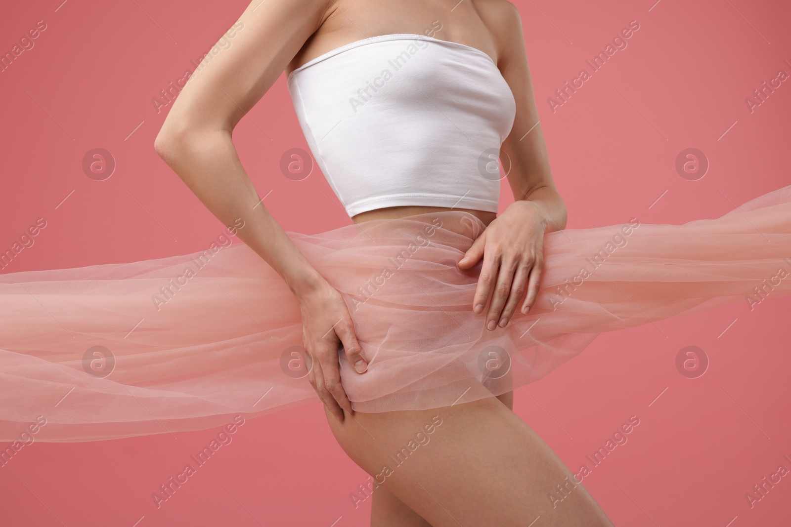Young woman with beautiful fabric on pink background, closeup Photo of Young woman with beautiful fabric on pink background, closeup