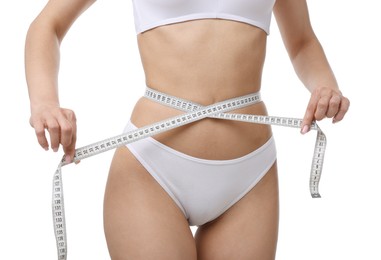 Photo of Woman with slim body and measuring tape on white background, closeup