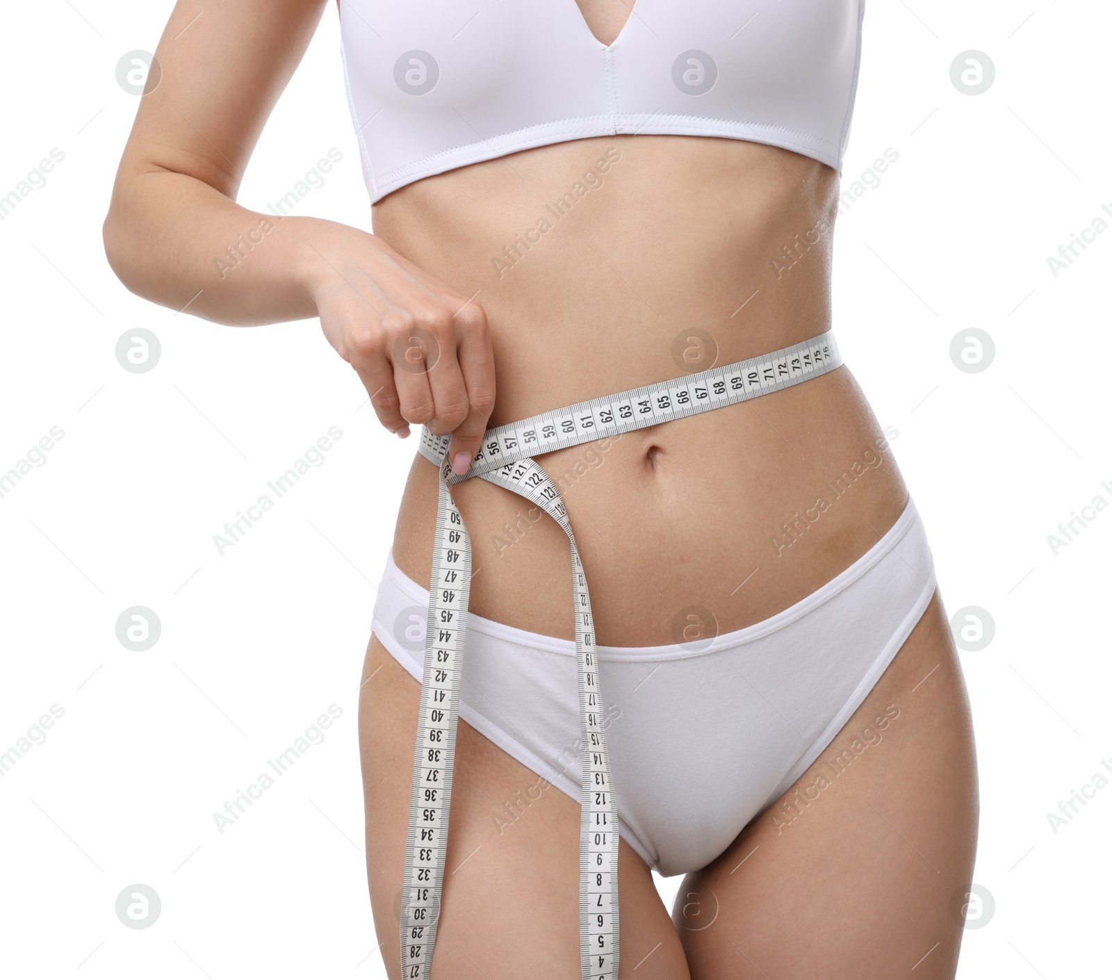 Woman with slim body and measuring tape on white background, closeup Photo of Woman with slim body and measuring tape on white background, closeup
