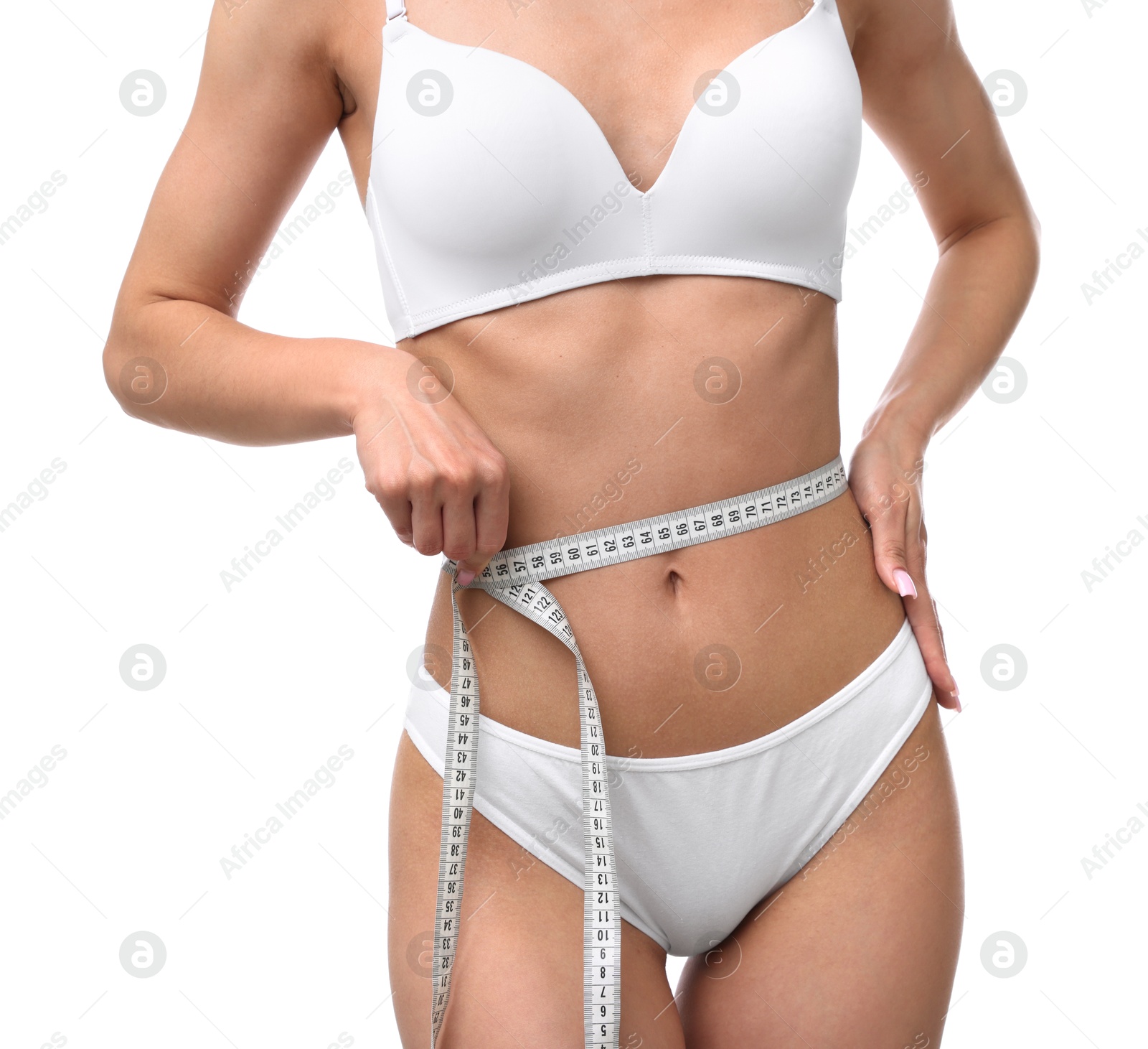 Woman with slim body and measuring tape on white background, closeup Photo of Woman with slim body and measuring tape on white background, closeup