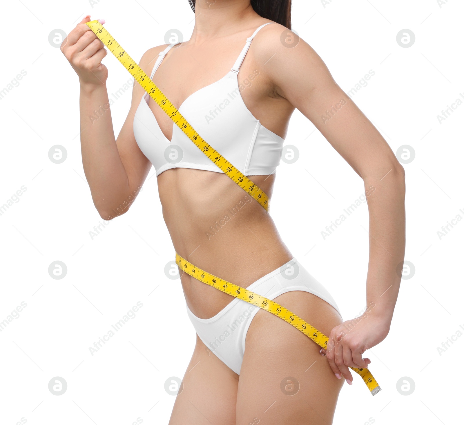 Woman with slim body and measuring tape on white background, closeup Photo of Woman with slim body and measuring tape on white background, closeup