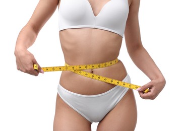 Photo of Woman with slim body and measuring tape on white background, closeup