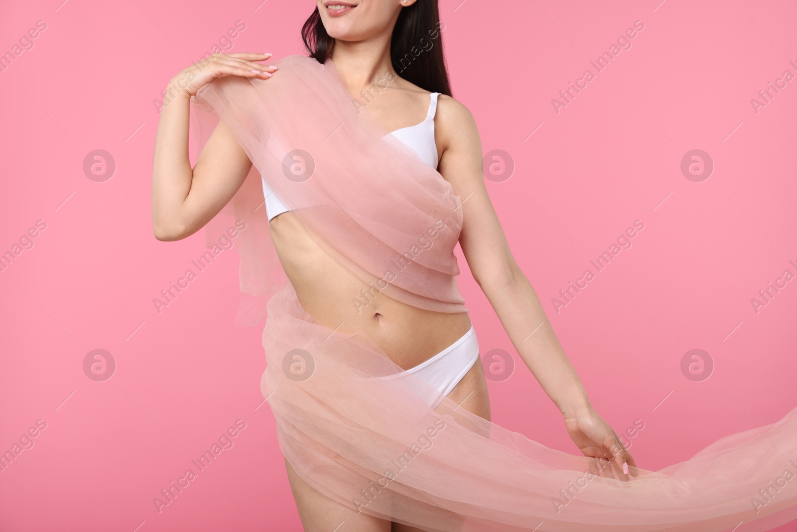 Woman with beautiful fabric on pink background, closeup Photo of Woman with beautiful fabric on pink background, closeup