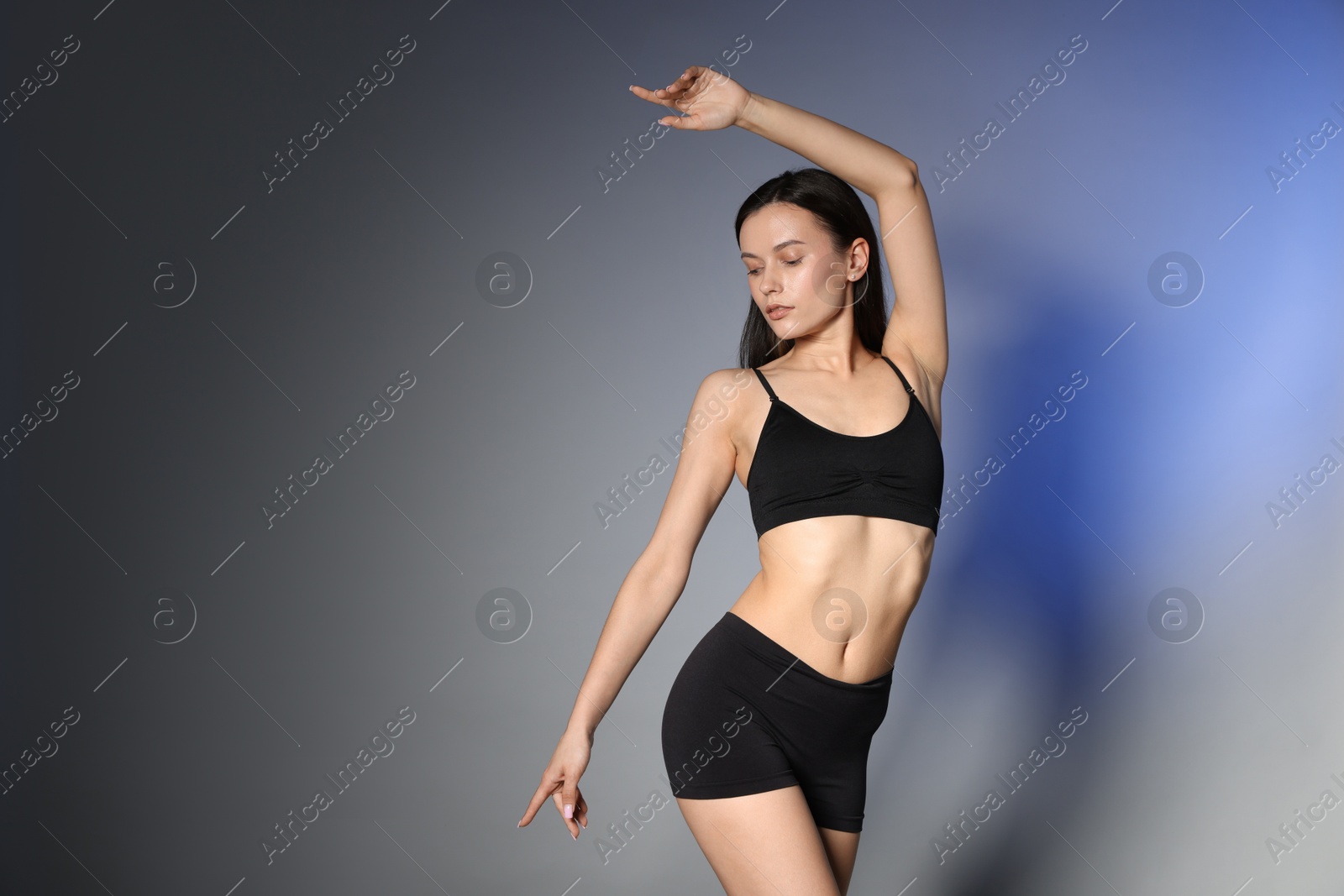 Beautiful woman with perfect slim body in studio, space for text Photo of Beautiful woman with perfect slim body in studio, space for text