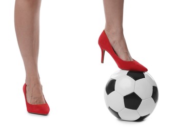 Photo of Woman in high heeled shoes with soccer ball on white background, closeup