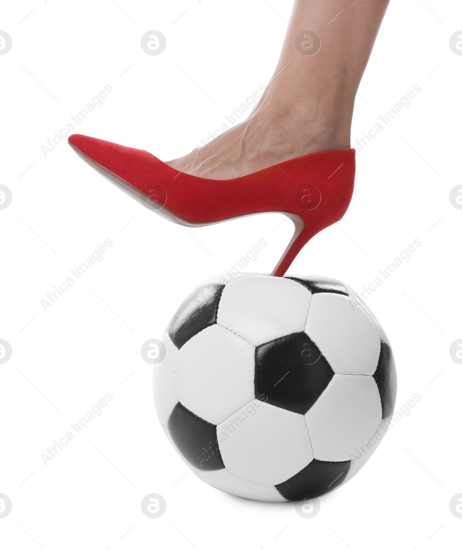 Photo of Woman in high heeled shoe with soccer ball on white background, closeup