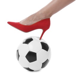 Photo of Woman in high heeled shoe with soccer ball on white background, closeup