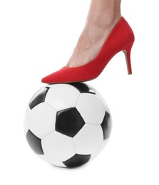 Photo of Woman in high heeled shoe with soccer ball on white background, closeup