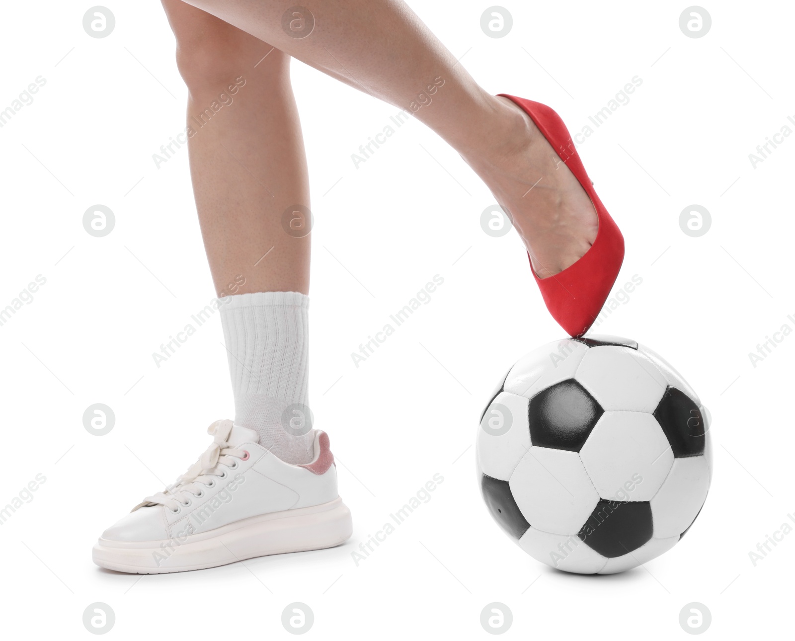 Photo of Woman in high heeled shoe and sneaker with soccer ball on white background, closeup