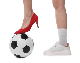 Photo of Woman in high heeled shoe and sneaker with soccer ball on white background, closeup