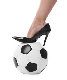 Photo of Woman in high heeled shoe with soccer ball on white background, closeup
