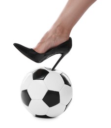 Photo of Woman in high heeled shoe with soccer ball on white background, closeup