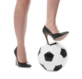 Photo of Woman in high heeled shoes with soccer ball on white background, closeup