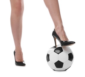 Photo of Woman in high heeled shoes with soccer ball on white background, closeup