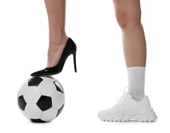 Photo of Woman in high heeled shoe and sneaker with soccer ball on white background, closeup