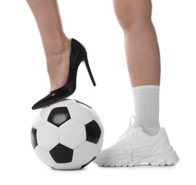 Photo of Woman in high heeled shoe and sneaker with soccer ball on white background, closeup