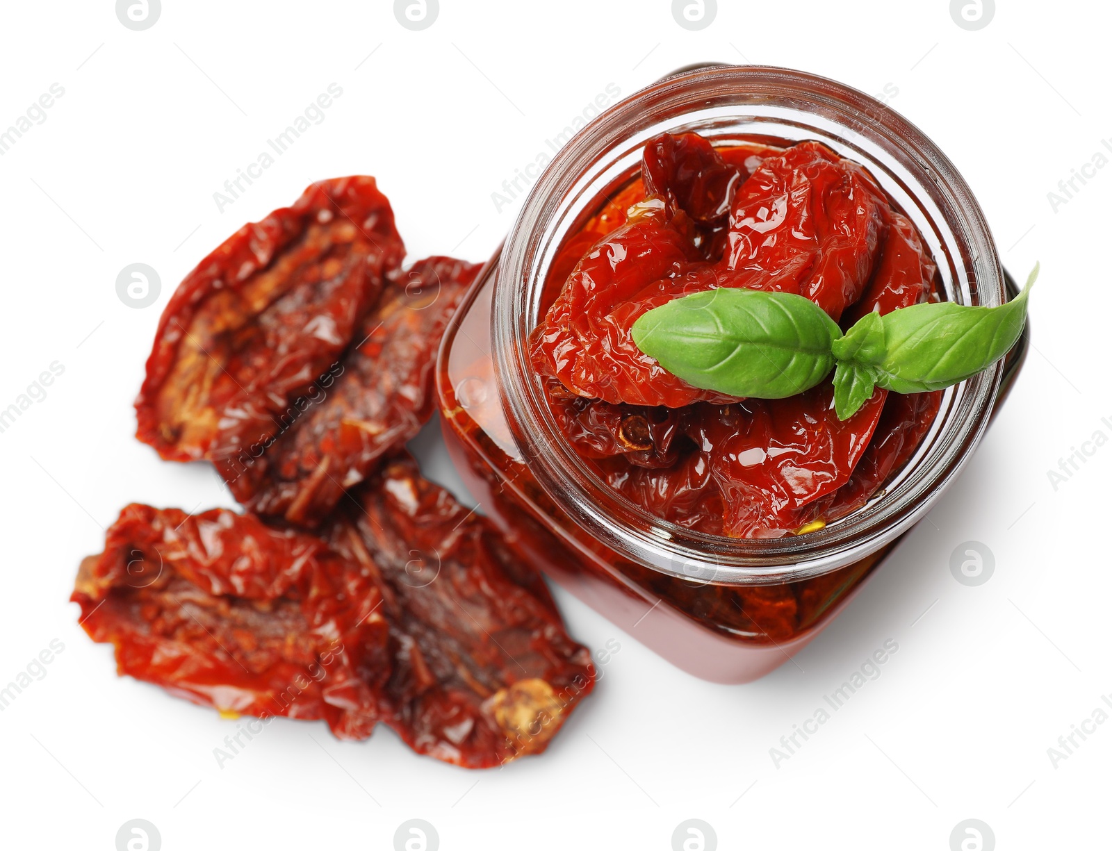 Tasty sun dried tomatoes and fresh basil isolated on white, top view Photo of Tasty sun dried tomatoes and fresh basil isolated on white, top view