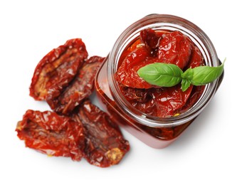 Photo of Tasty sun dried tomatoes and fresh basil isolated on white, top view