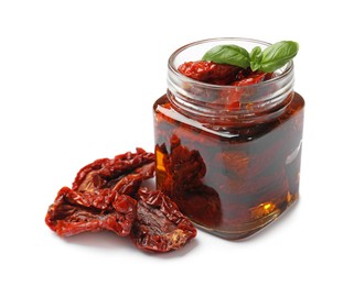 Photo of Tasty sun dried tomatoes and fresh basil isolated on white