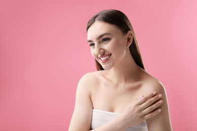 Photo of Portrait of beautiful woman on pink background. Space for text