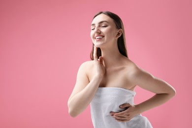 Photo of Portrait of beautiful woman on pink background. Space for text