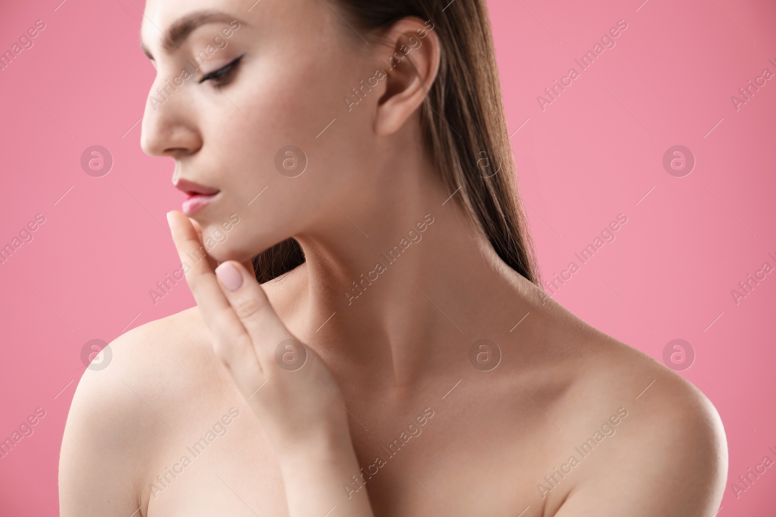 Woman with beautiful collarbones and neck on pink background, closeup Photo of Woman with beautiful collarbones and neck on pink background, closeup