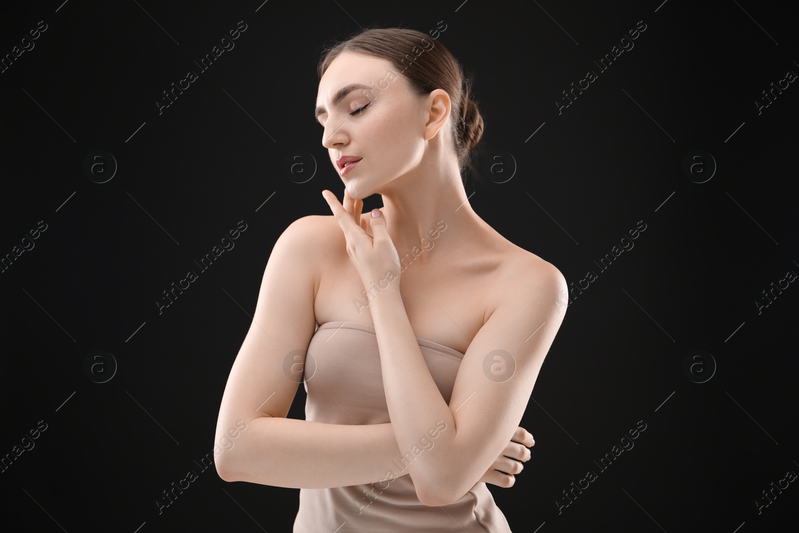 Portrait of beautiful woman on black background Photo of Portrait of beautiful woman on black background