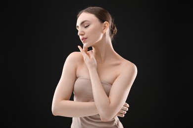 Photo of Portrait of beautiful woman on black background
