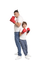 Photo of Father and his son in boxing gloves on white background
