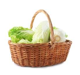 Photo of Fresh Chinese cabbages in wicker basket isolated on white