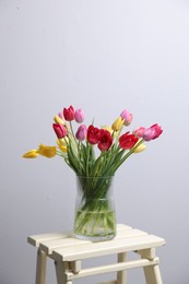 Photo of Bouquet of beautiful tulips on table indoors