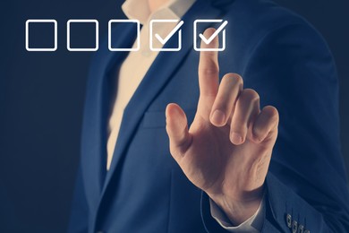 Image of Approved. Man touching check mark on virtual screen against dark background, closeup