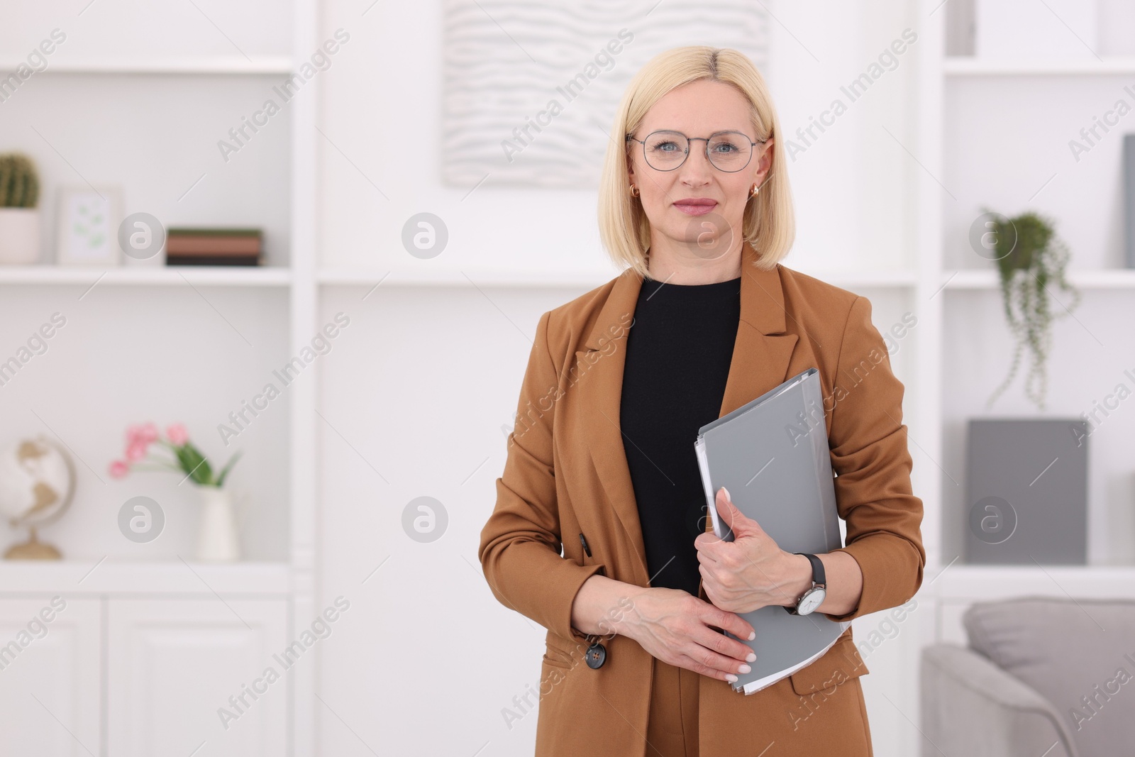 Professional psychologist with documents in office, space for text Photo of Professional psychologist with documents in office, space for text