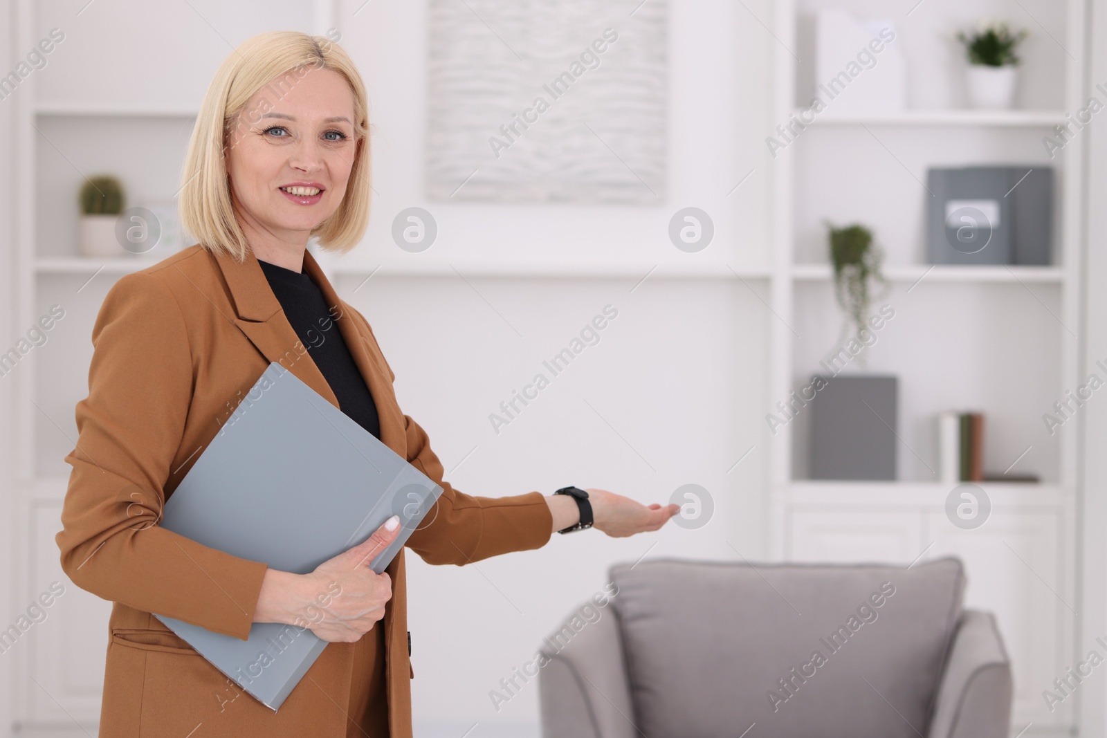 Photo of Professional psychologist with documents in office, space for text