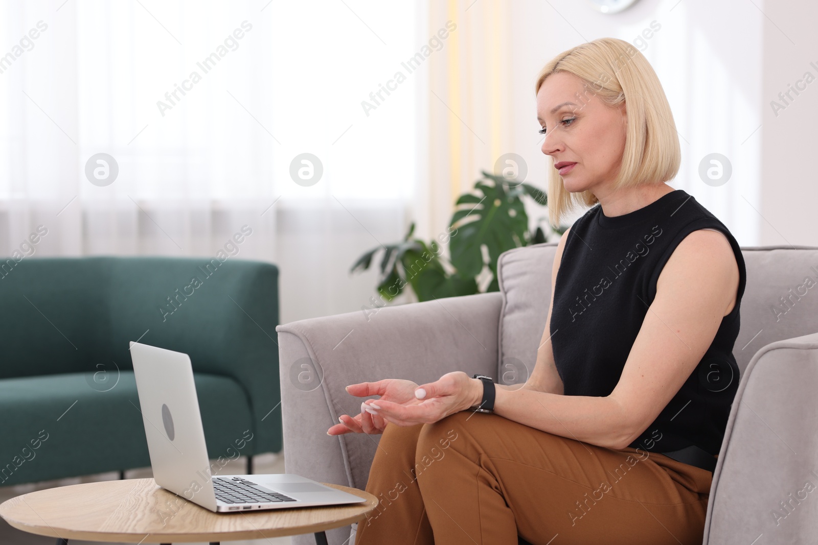 Professional psychologist working with laptop in office Photo of Professional psychologist working with laptop in office