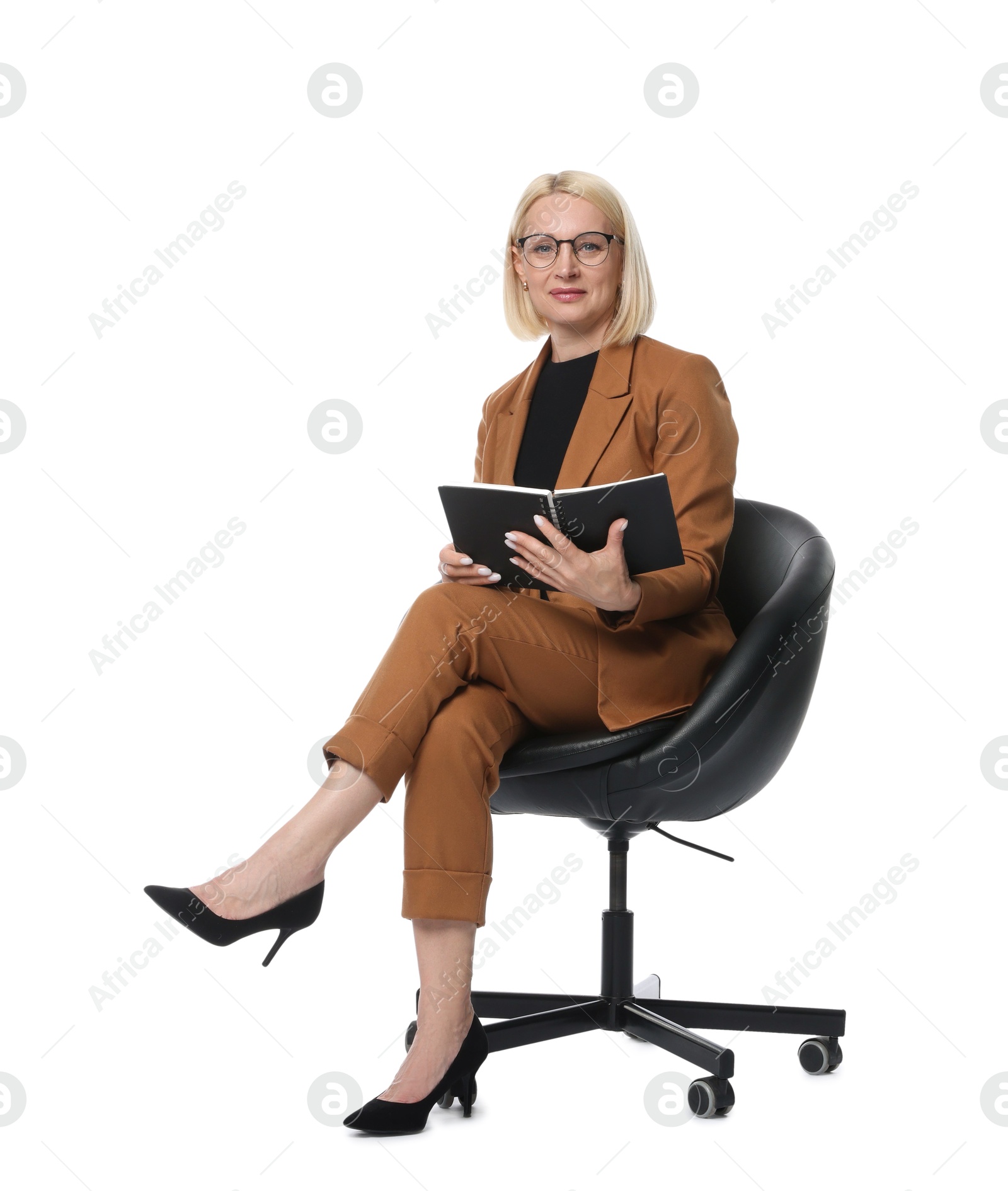 Professional psychologist with notebook in office chair on white background Photo of Professional psychologist with notebook in office chair on white background