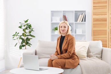 Photo of Portrait of professional psychologist on sofa in office