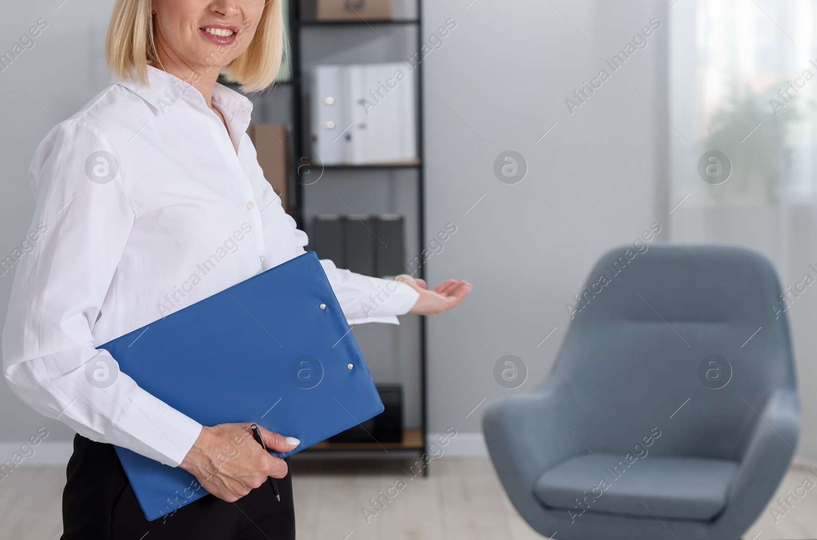 Professional psychologist with clipboard in office, closeup. Space for text Photo of Professional psychologist with clipboard in office, closeup. Space for text