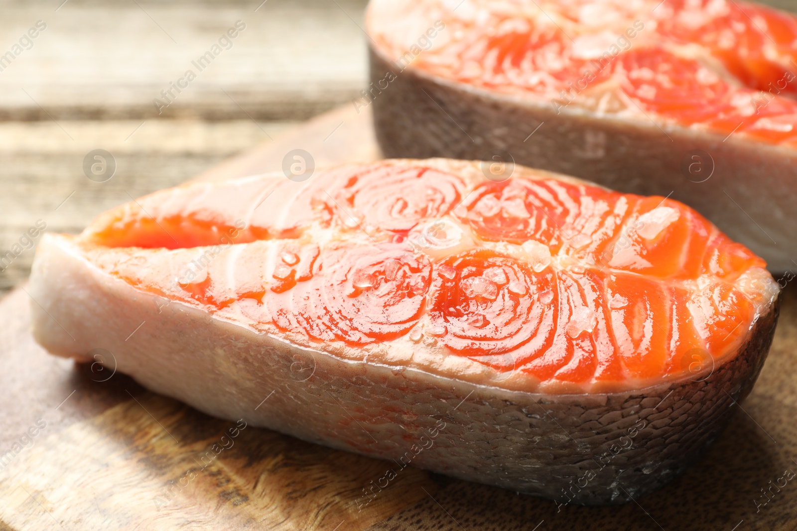 Seafood. Fresh raw salmon steaks on table, closeup Photo of Seafood. Fresh raw salmon steaks on table, closeup