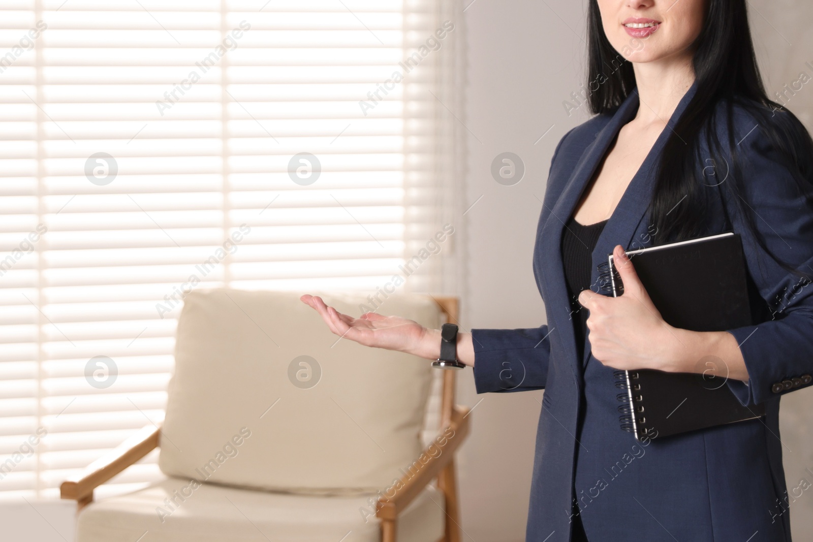 Professional psychologist with notebook in office, closeup. Space for text Photo of Professional psychologist with notebook in office, closeup. Space for text